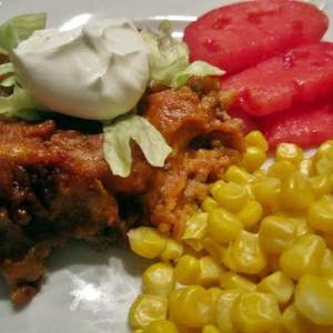 Dos Enchiladas, Arroz Y Frijoles